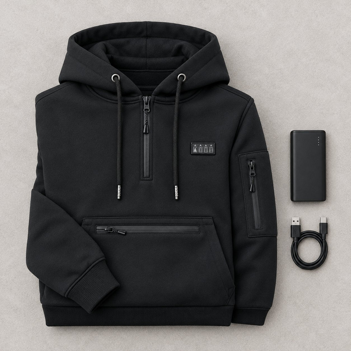 What's in the box: the black heated hoodie folded, a USB power bank and a USB cable