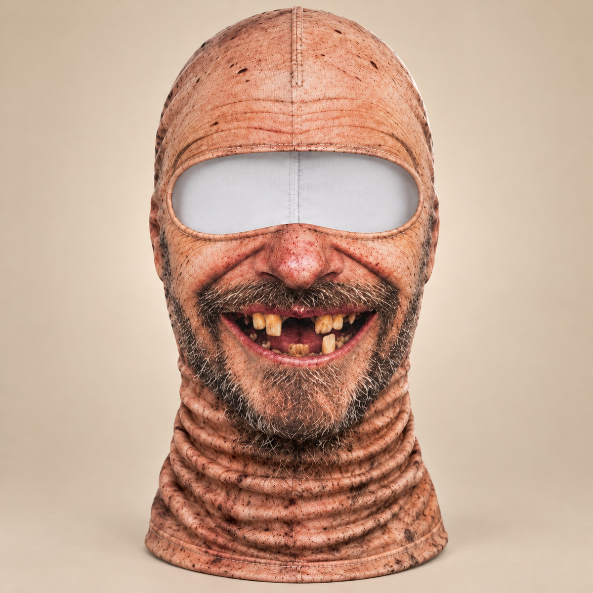 The Toothless Grin balaclava: bald printed head, stubble beard and a gap-tooth grin, with the stretch neck tube