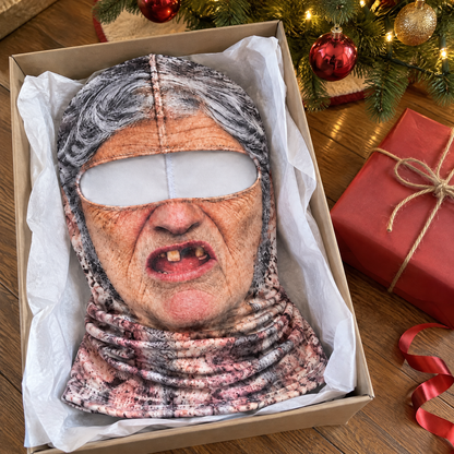 The Granny balaclava in a gift box with tissue paper under the Christmas tree