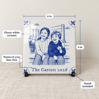 Front view of the 6 x 6 in glossy Delft-blue photo tile with the names line The Carters 2026, on its black stand