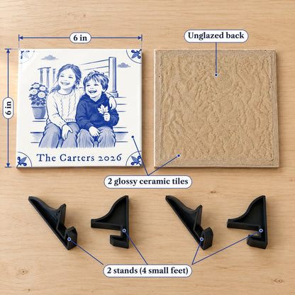 Two 6 x 6 in glossy ceramic tiles, one showing its unglazed back, and four small black plastic stand feet