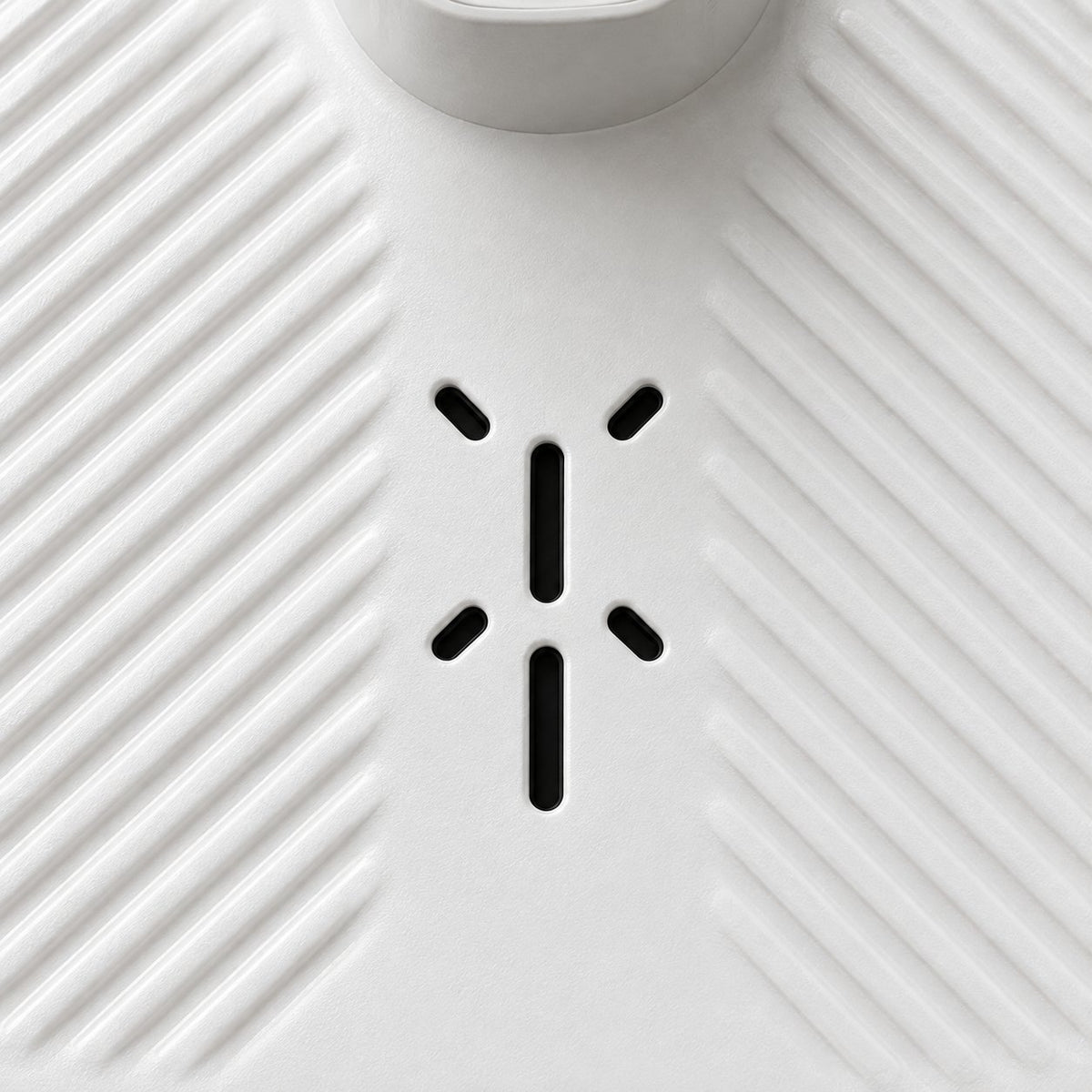Close-up of the ribbed anti-slip top and the six air vents of the body dryer