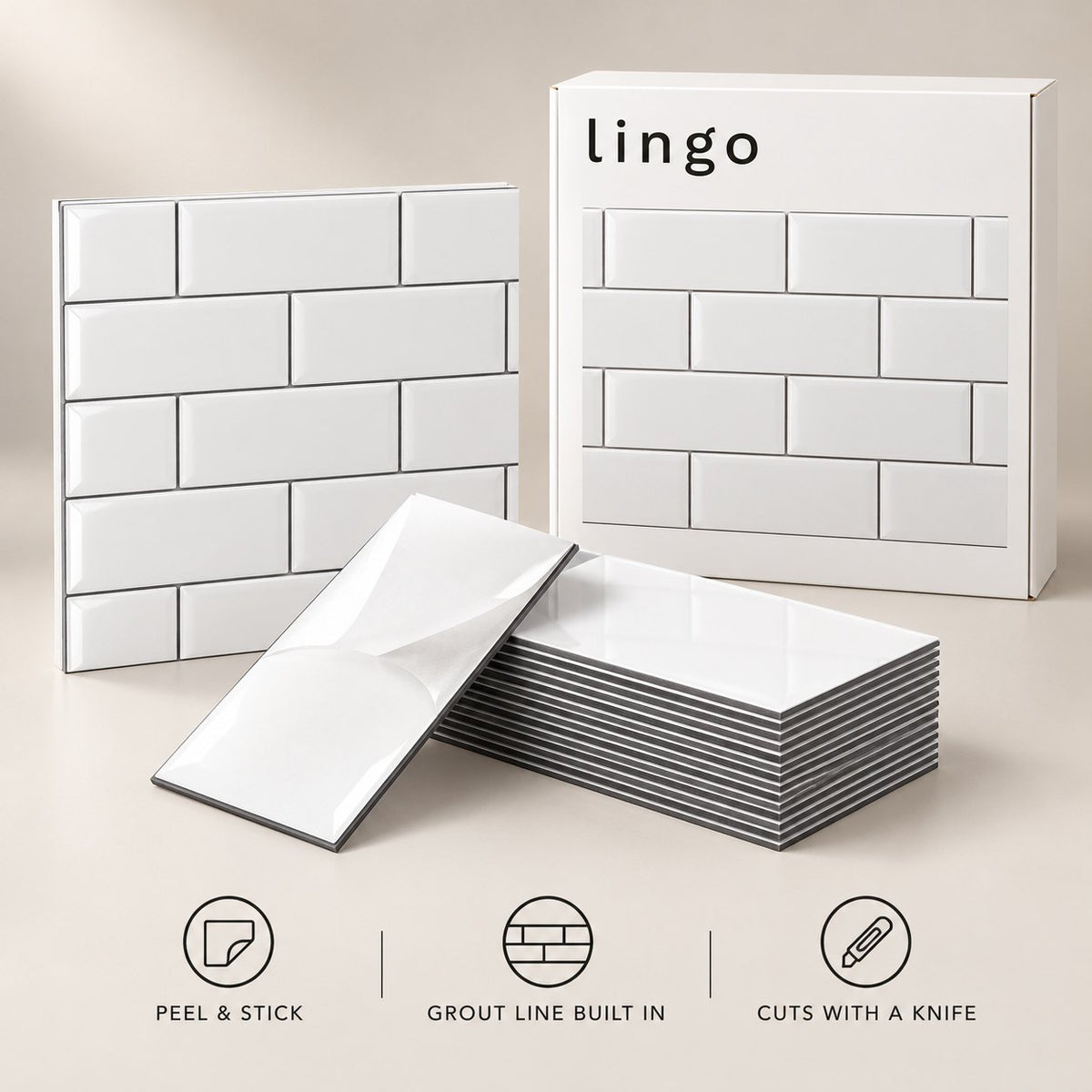 Glossy white peel and stick subway tiles, one with its backing peeled, and the lingo box