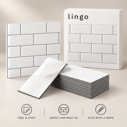 Glossy white peel and stick subway tiles, one with its backing peeled, and the lingo box