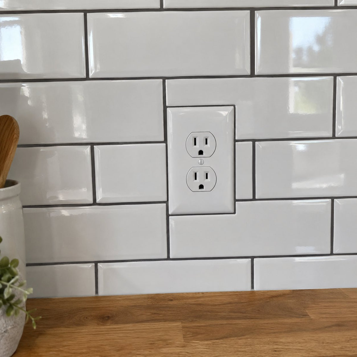 Tiles cut around an outlet