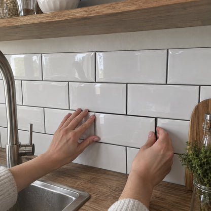 Pressing a tile on the wall