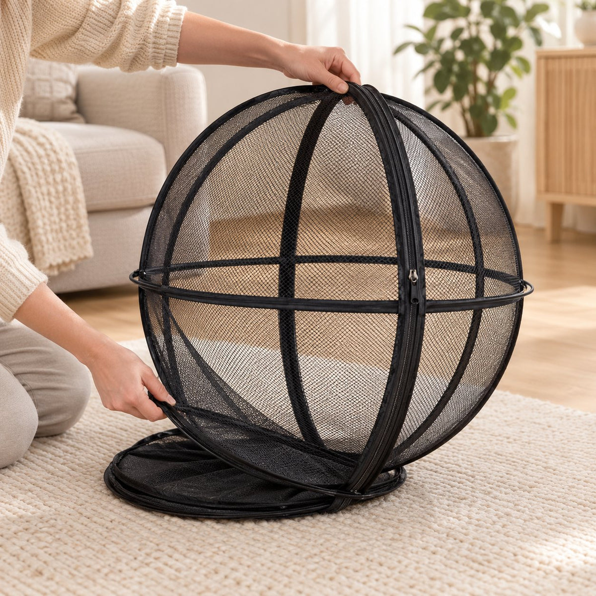 Popping the playpen ball open from its folded disc
