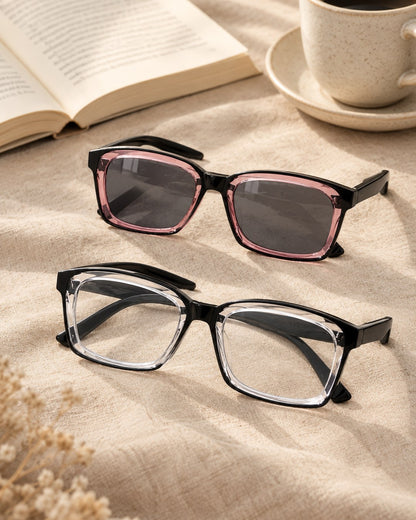 Two pairs of the reading glasses on linen: one with clear lenses, one with lenses tinted like sunglasses