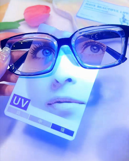 Lens test card held behind the glasses, real photo