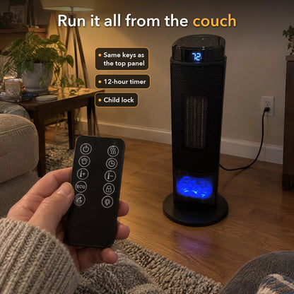 Hand holding the heater's remote, pointed at the heater across the room