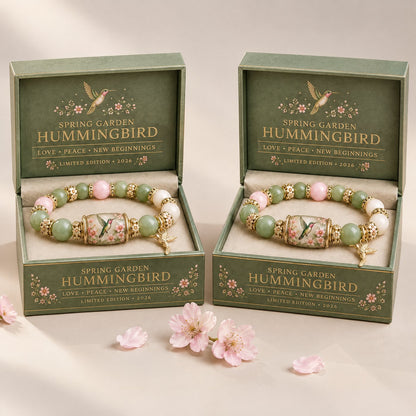 Two hummingbird bracelets in their gift boxes