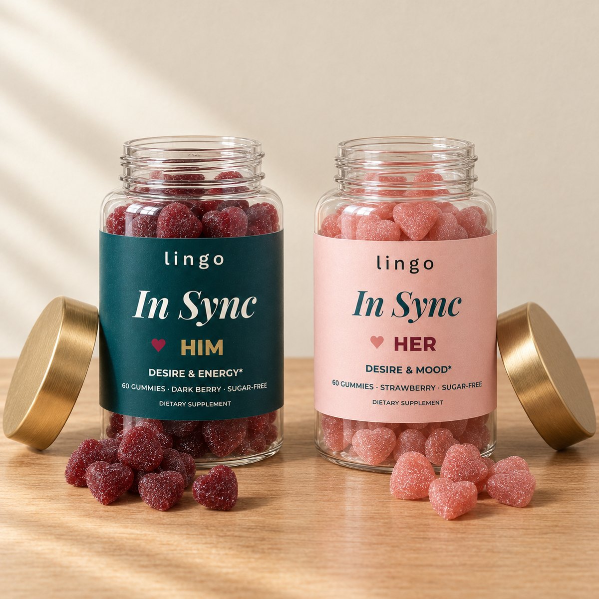 The HIM jar with wine-red heart gummies and the HER jar with pink heart gummies, caps off