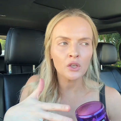 Creator holding the jar in her car, frame from her video