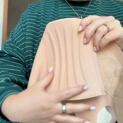 The back panel of the band with its flexible ribs, held in hand