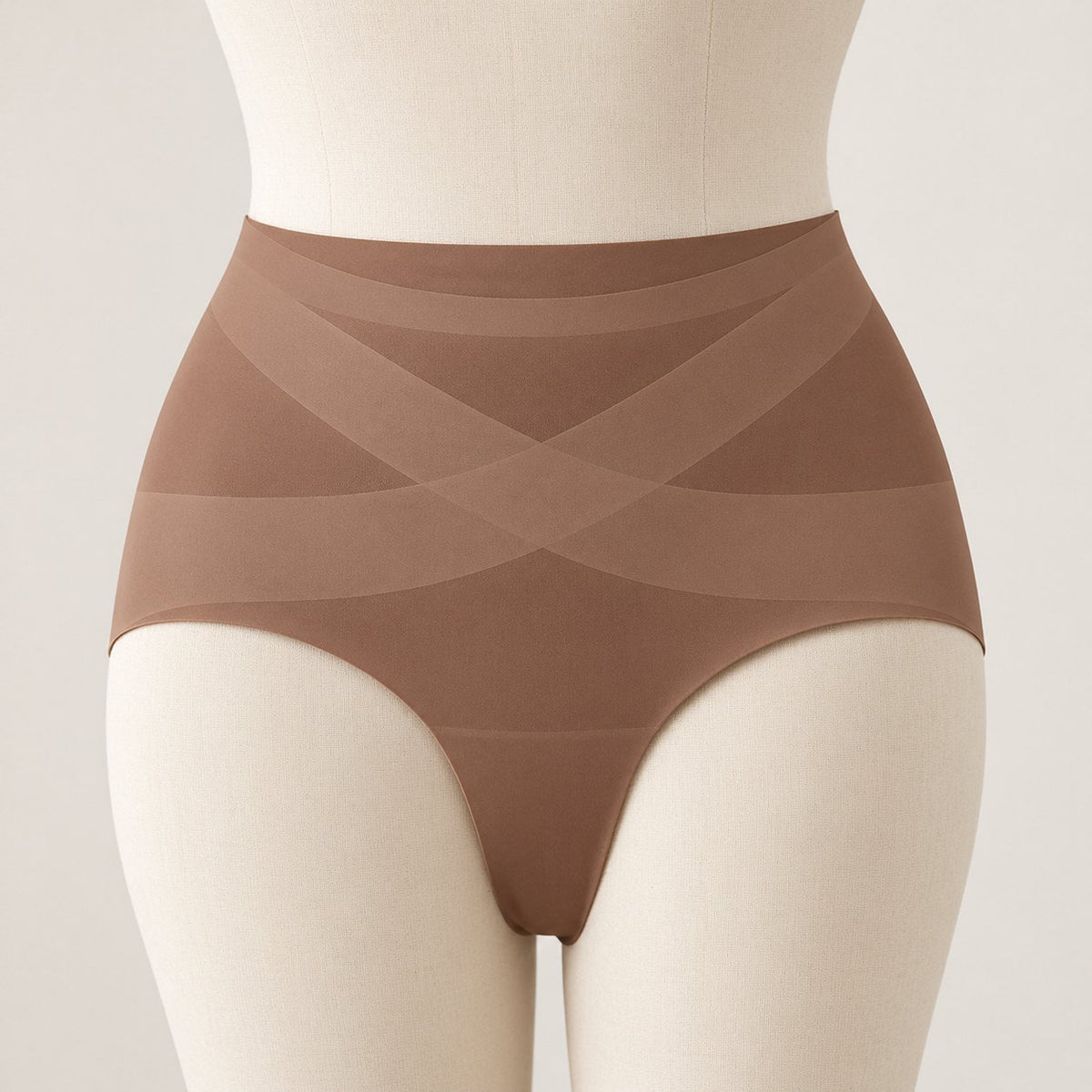 Mocha No Show brief on a dress form: high flat waistband and the crossed X band over the lower belly