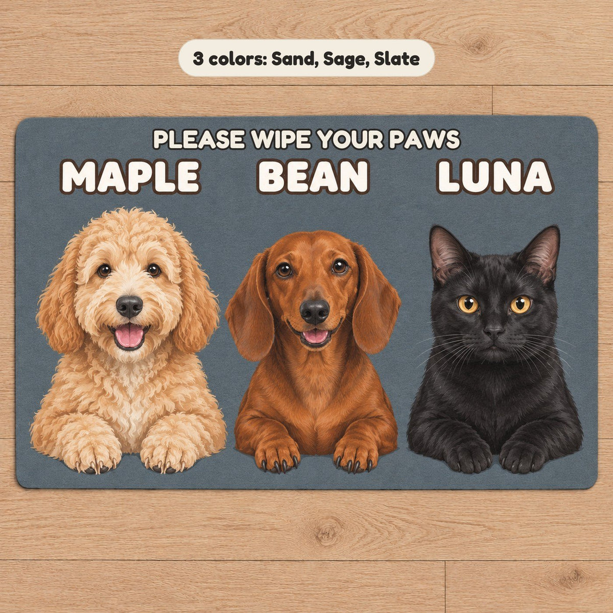 A slate doormat with a goldendoodle, a dachshund and a black cat named Maple, Bean and Luna under the words Please wipe your paws