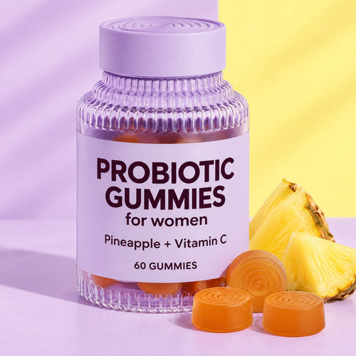 Pineapple probiotic gummies bottle with orange gummies and pineapple chunks