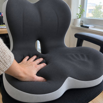 Hand pressing into the slow-rebound memory foam of the seat cushion