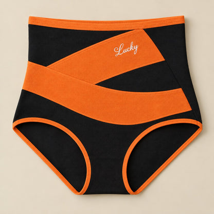 Front of the shaping brief: black knit with a wide crossed orange band and orange trim