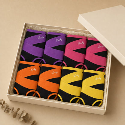 The 8-pack of shaping briefs folded in an open cream gift box