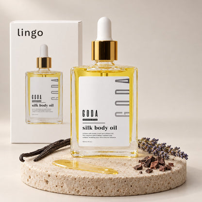 Silk Body Oil on a stone with vanilla, lavender and cacao, the lingo box behind