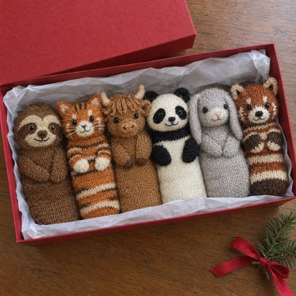 Open red gift box with the six animal socks: sloth, cat, highland cow, panda, bunny and red panda