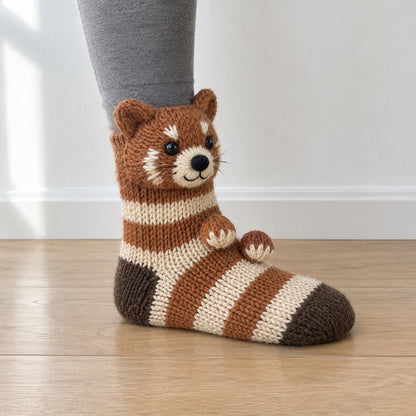 Cream and rust striped knit sock with a 3D knitted red panda head