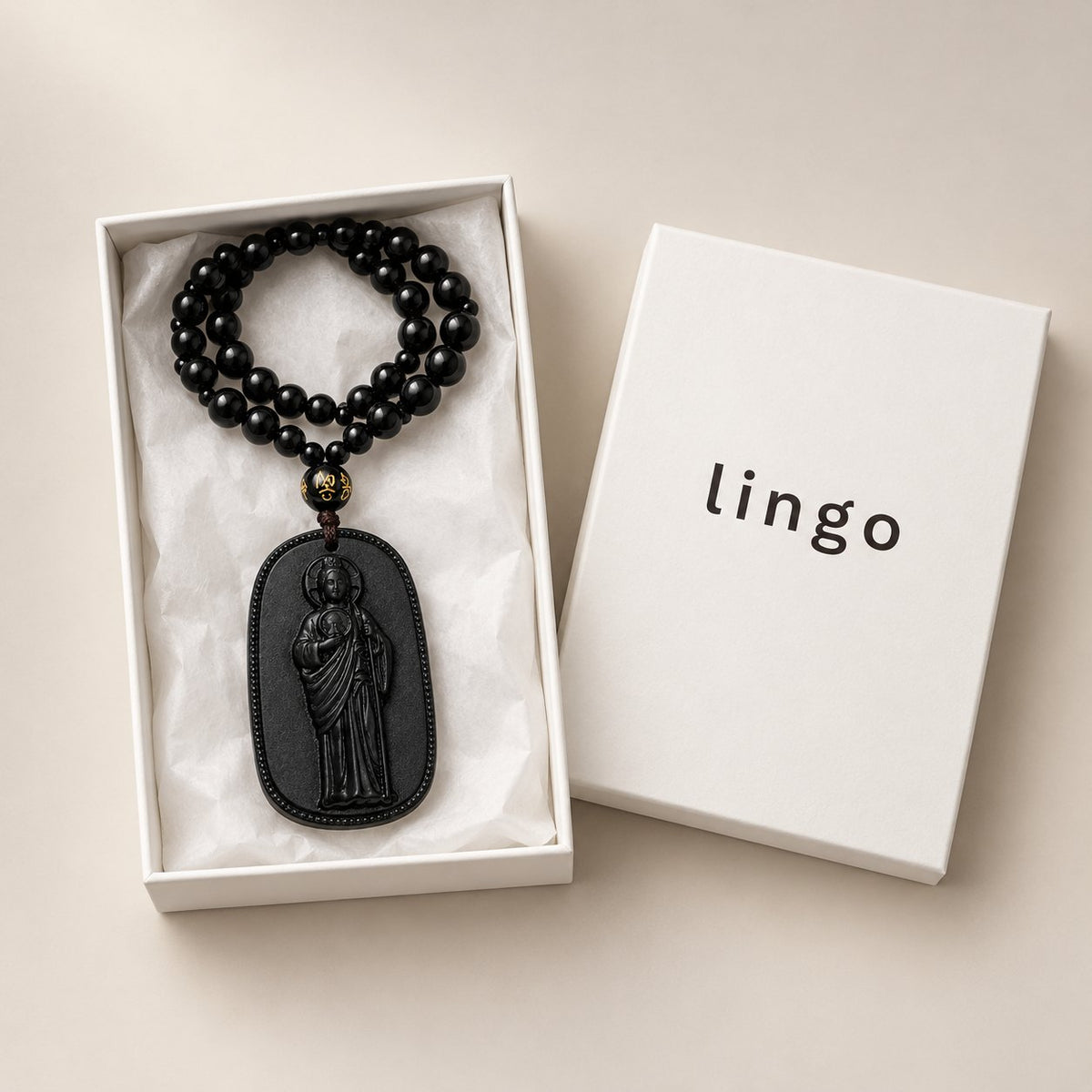 What's in the box: the San Judas Tadeo necklace in the lingo box