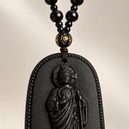 The black beads and the gold-symbol bead above the pendant