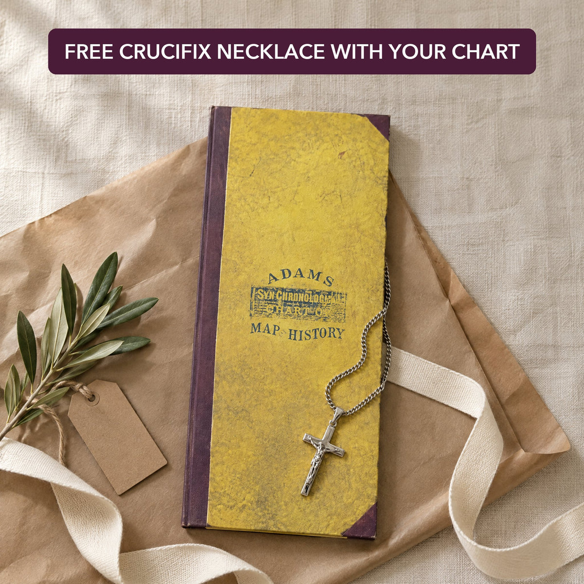 The chart ready to wrap, with the free crucifix pendant necklace resting on its cover