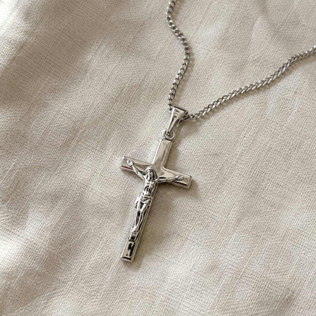 The free crucifix pendant necklace included with the chart