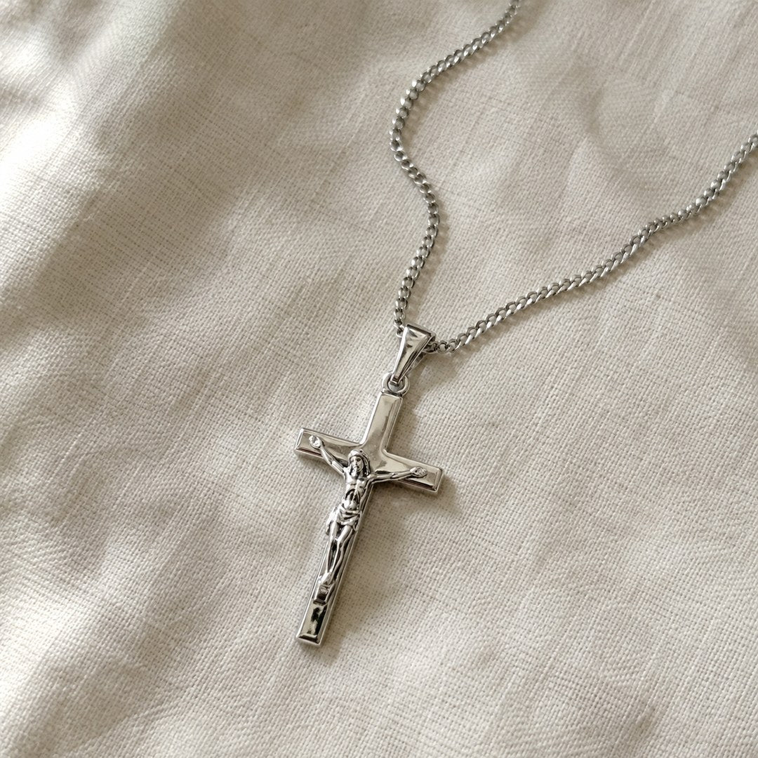 The free crucifix pendant necklace that comes with the chart