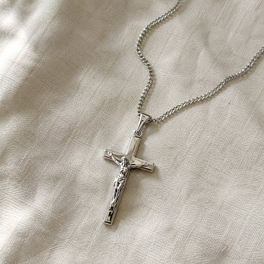 The free crucifix pendant necklace that comes with the chart