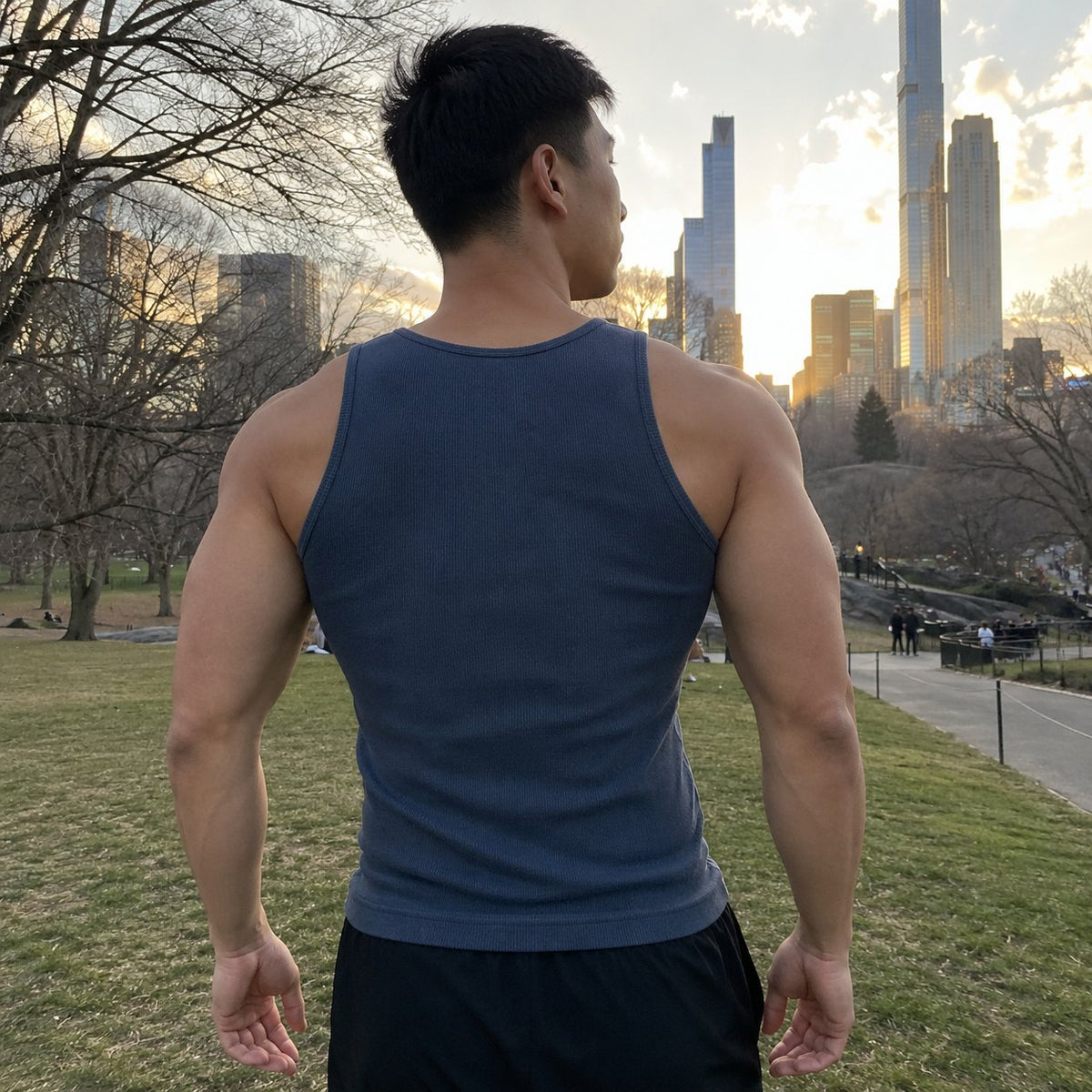 Back view of the steel blue tank: wide straps over the shoulders and a wide back panel that covers the shoulder blades