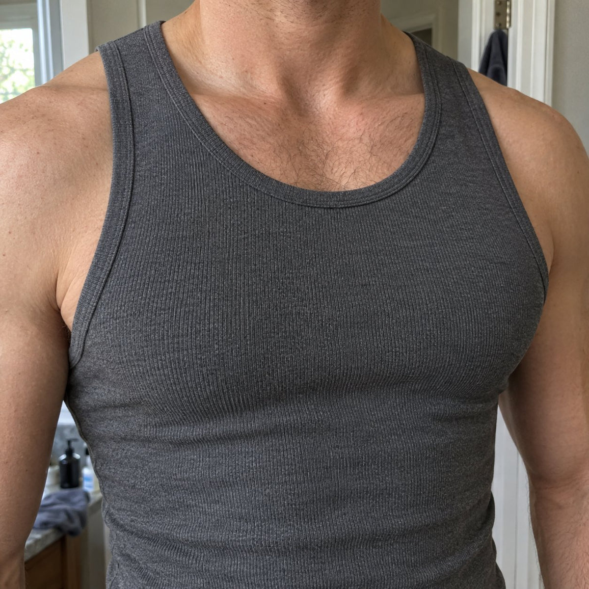 Close-up of the grey tank: the round neckline lies flat