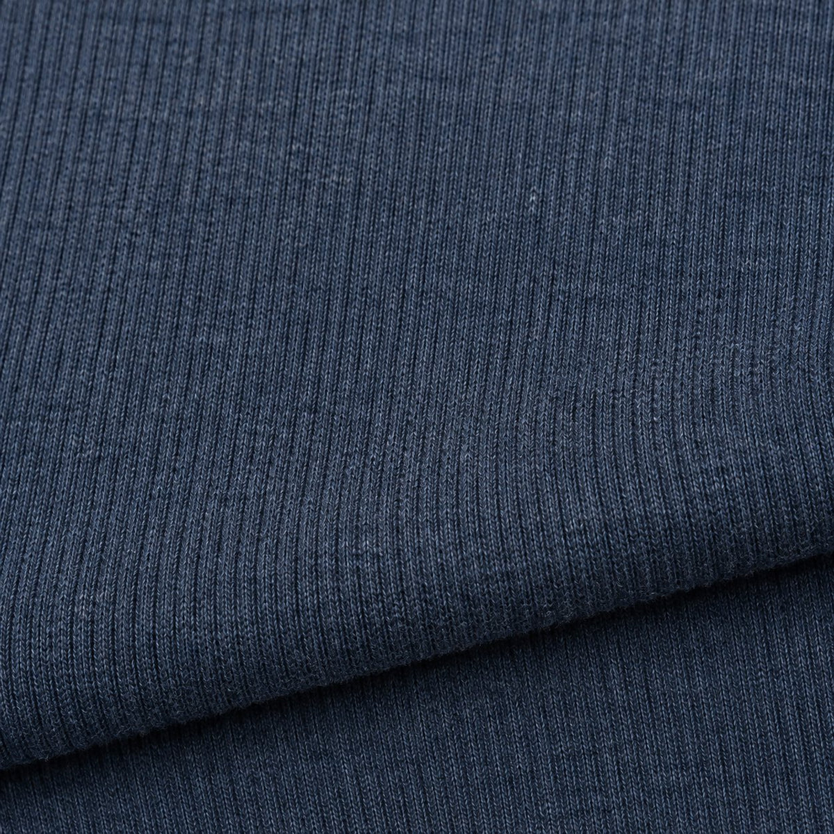 Close-up of the thick ribbed cotton knit in steel blue