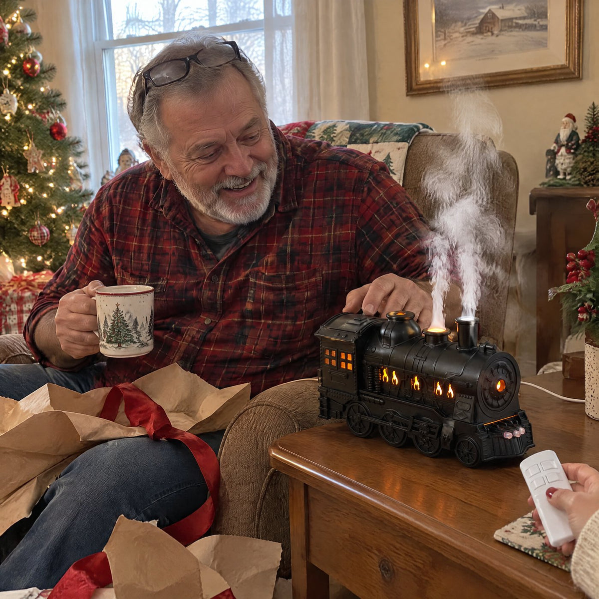 A man smiling at his new steam train diffuser puffing mist beside his armchair on Christmas morning