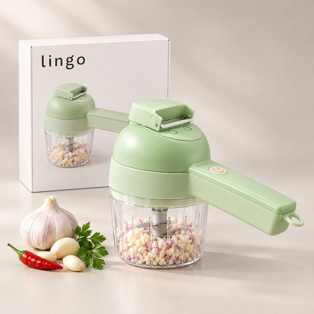 Cordless vegetable cutter full of minced garlic, next to its lingo box