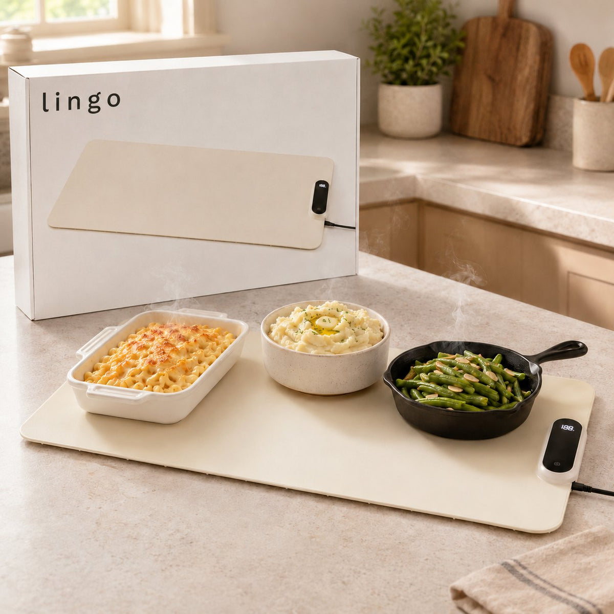 Roll-up food warming mat laid flat with three hot dishes and its lingo box