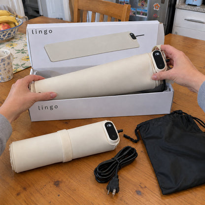 Unboxing the rolled-up warming mat from its lingo box