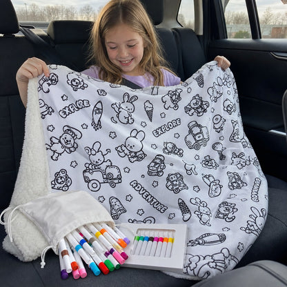 The blanket and markers coming out of the carrying bag in the car
