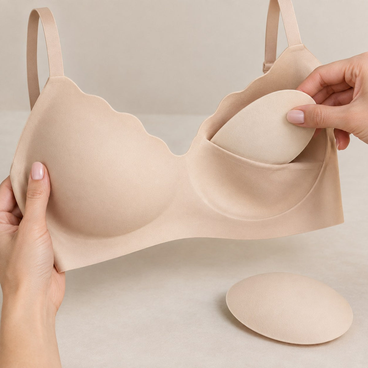 Sliding a removable pad into the cup pocket