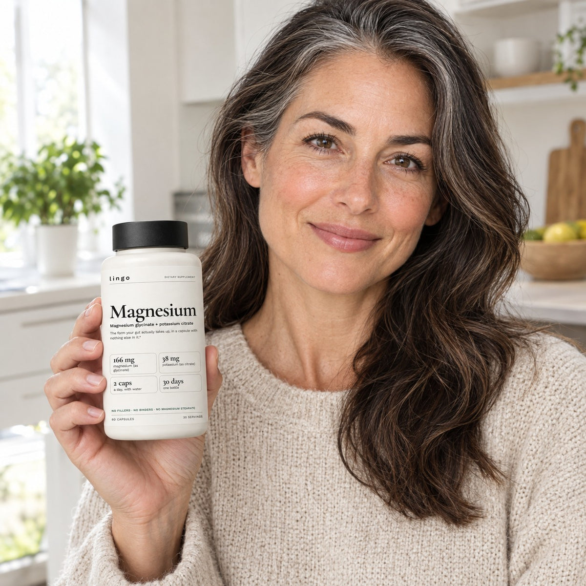 Woman holding a bottle of Lingo Magnesium