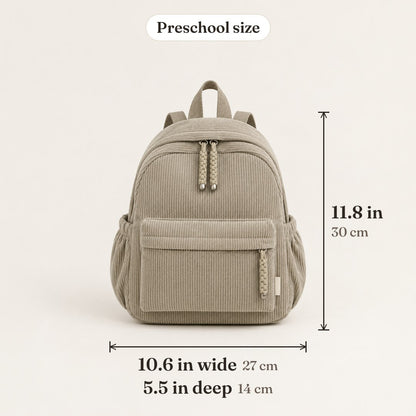 A khaki corduroy backpack with its size marked: 11.8 in tall, 10.6 in wide, 5.5 in deep