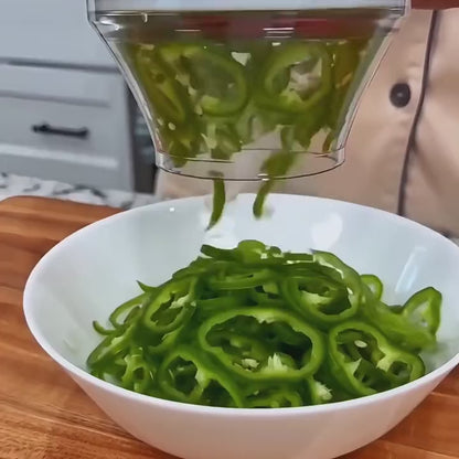 Cucumber slices falling from the cutter into a bowl