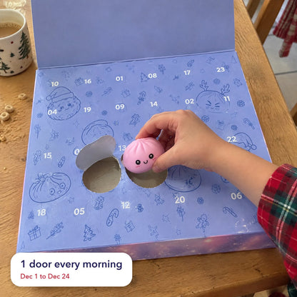 A child's hand pushing in a numbered door on the periwinkle door panel and pulling out a pink dumpling